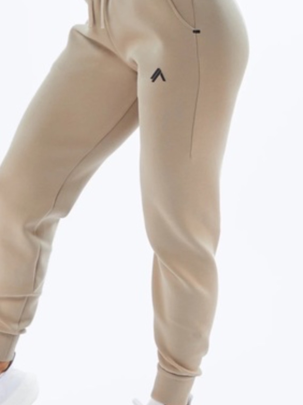 Alphalete Athletics ELMTS Joggers in a tan/beige colorway, size XS